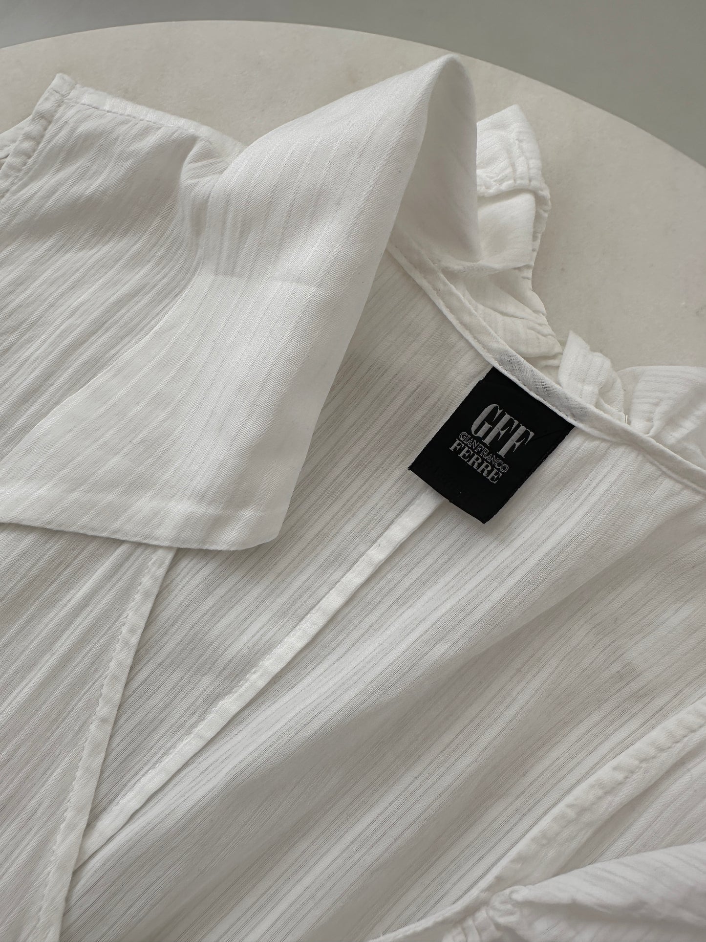 Ferré white blouse with asymmetric ruffle detail