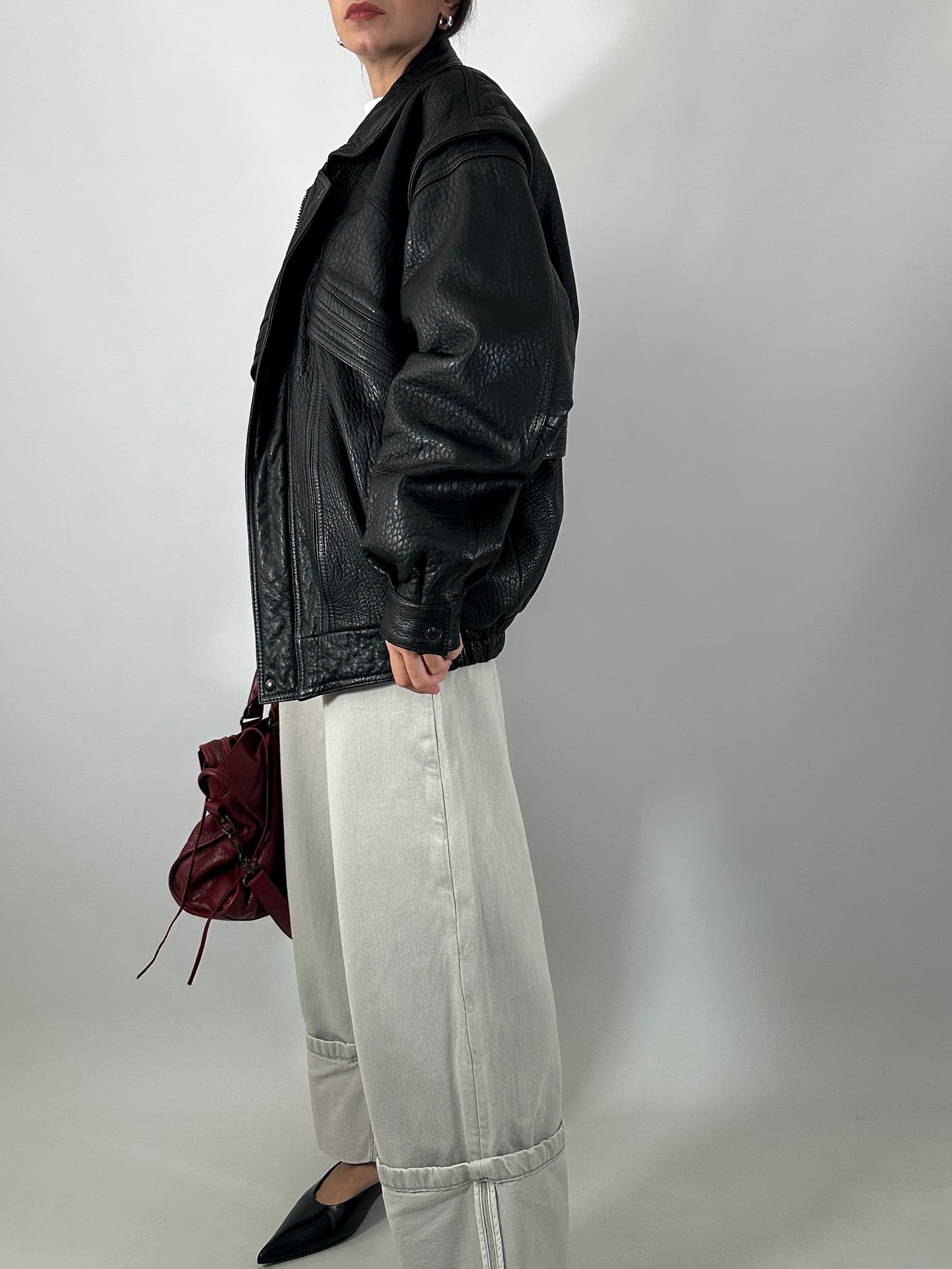 Vintage leather bomber jacket with detachable sleeves